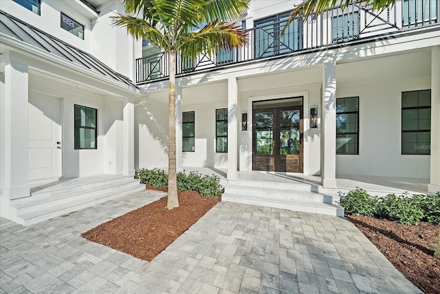 doorway to property with french doors and a balcony