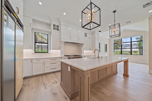 656 Tropical Cir, Sarasota, FL 34242 - kitchen featuring a sink, visible vents, stainless steel appliances, and a notable chandelier