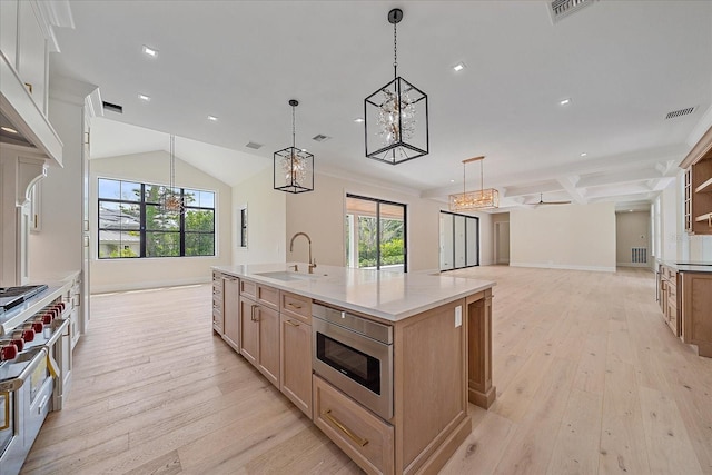 656 Tropical Cir, Sarasota, FL 34242 - kitchen featuring an inviting chandelier, a healthy amount of sunlight, a sink, and visible vents