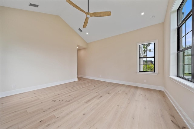 656 Tropical Cir, Sarasota, FL 34242 - empty room featuring a ceiling fan, visible vents, high vaulted ceiling, baseboards, and light wood-style floors