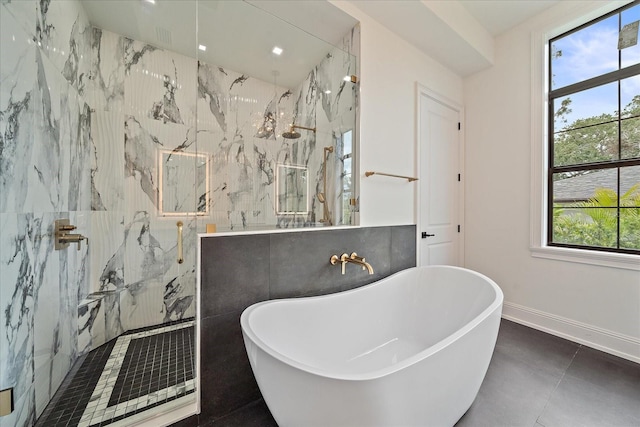 656 Tropical Cir, Sarasota, FL 34242 - full bathroom featuring a soaking tub, baseboards, and a marble finish shower