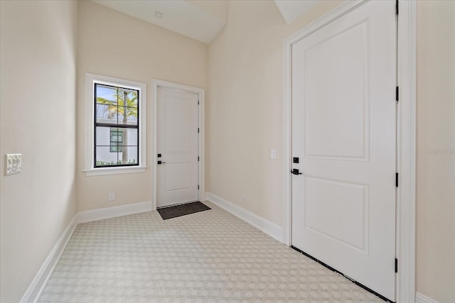 656 Tropical Cir, Sarasota, FL 34242 - carpeted entrance foyer with baseboards
