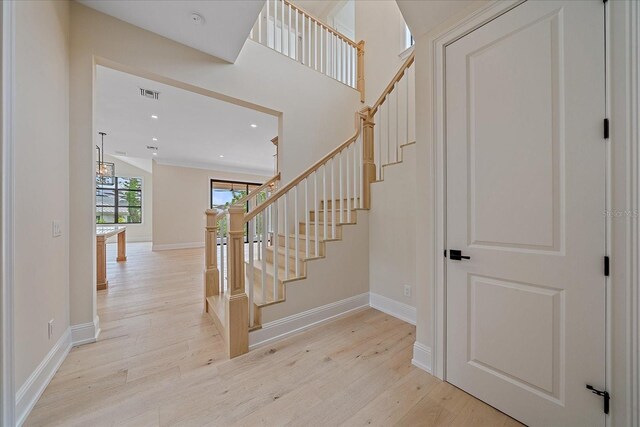 656 Tropical Cir, Sarasota, FL 34242 - stairs with recessed lighting, baseboards, visible vents, and wood finished floors