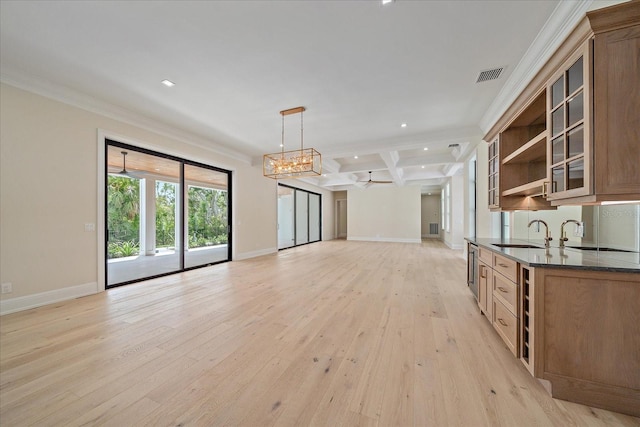 656 Tropical Cir, Sarasota, FL 34242 - interior space featuring open shelves, open floor plan, baseboards, light wood-type flooring, and visible vents