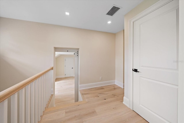 656 Tropical Cir, Sarasota, FL 34242 - hall with visible vents, baseboards, recessed lighting, light wood finished floors, and an upstairs landing
