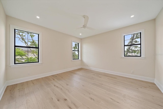 656 Tropical Cir, Sarasota, FL 34242 - unfurnished room with plenty of natural light and light wood-style flooring