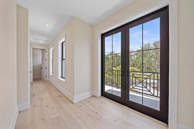 656 Tropical Cir, Sarasota, FL 34242 - doorway featuring french doors, recessed lighting, light wood-style floors, and baseboards