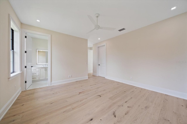 656 Tropical Cir, Sarasota, FL 34242 - unfurnished bedroom with ensuite bath, a ceiling fan, baseboards, light wood-type flooring, and visible vents