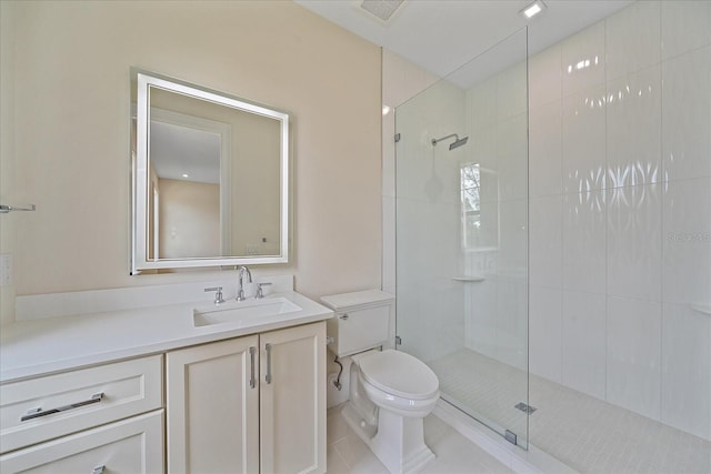 656 Tropical Cir, Sarasota, FL 34242 - bathroom featuring a tile shower, vanity, toilet, tile patterned floors, and visible vents