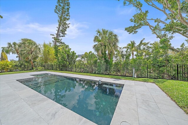 656 Tropical Cir, Sarasota, FL 34242 - view of pool featuring a fenced in pool, a patio area, fence, and an in ground hot tub
