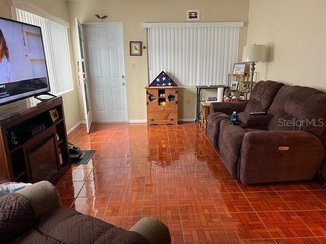 living room featuring parquet flooring