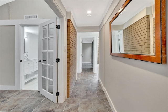 hallway featuring crown molding