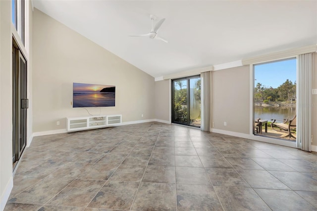 unfurnished living room with light tile patterned floors, high vaulted ceiling, and ceiling fan