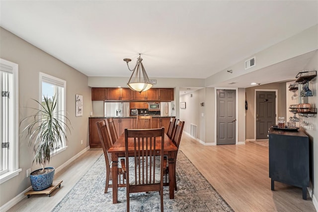 dining room with light hardwood / wood-style flooring