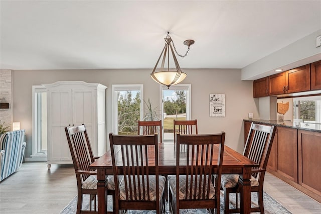 dining space featuring light hardwood / wood-style flooring