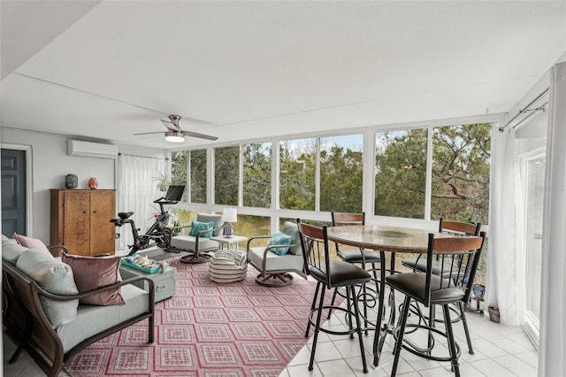 sunroom featuring ceiling fan and a wall mounted air conditioner