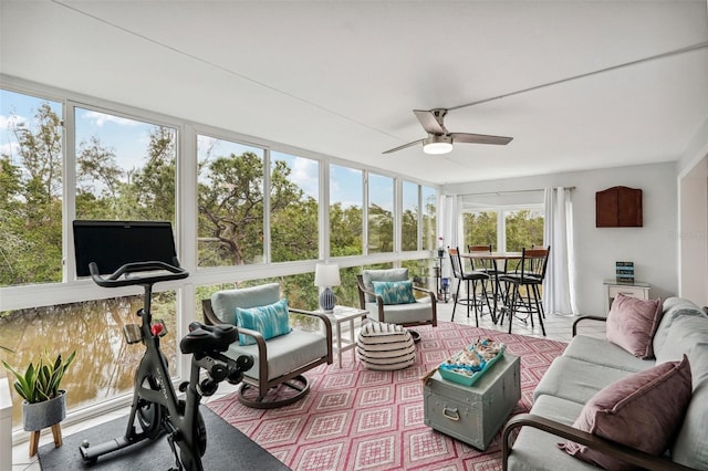 sunroom with ceiling fan