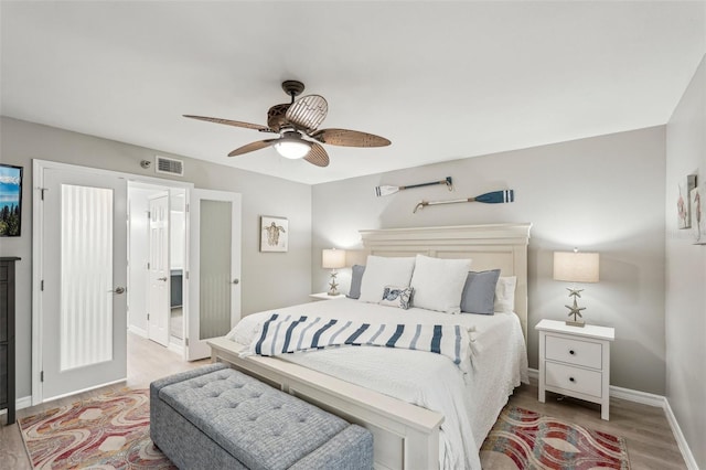 bedroom with hardwood / wood-style flooring and ceiling fan