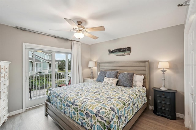 bedroom with hardwood / wood-style flooring, ceiling fan, and access to outside