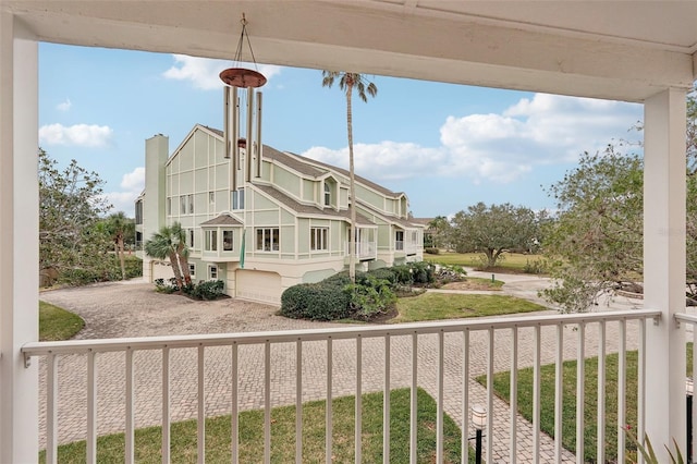 rear view of property featuring a garage