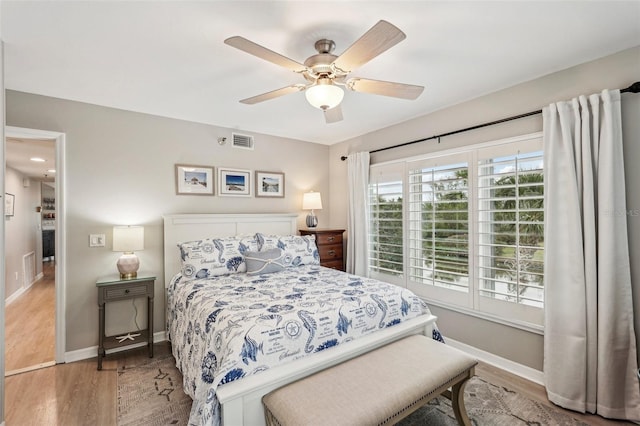 bedroom with ceiling fan and light wood-type flooring