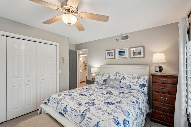 bedroom featuring ceiling fan, light hardwood / wood-style floors, and a closet