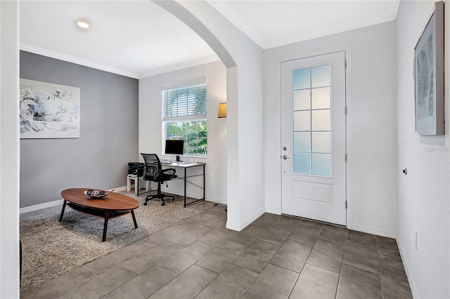 entryway featuring light tile patterned floors and ornamental molding