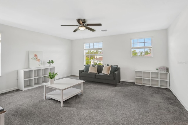 carpeted living room with ceiling fan