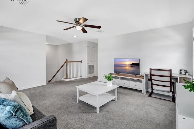 carpeted living room with ceiling fan