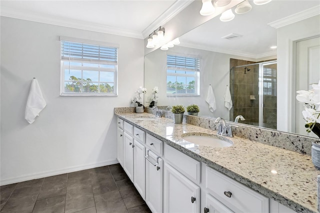 bathroom with crown molding, tile patterned floors, vanity, and walk in shower