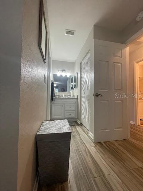 bathroom with hardwood / wood-style flooring and vanity