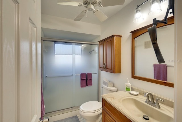 bathroom with vanity, an enclosed shower, ceiling fan, and toilet