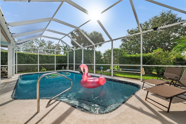 view of pool with a lanai and a patio