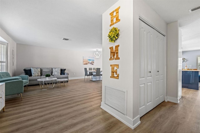 hall with hardwood / wood-style floors