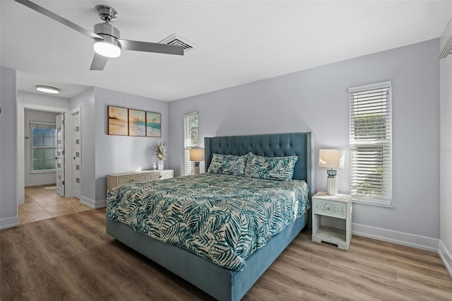 bedroom featuring hardwood / wood-style flooring and ceiling fan