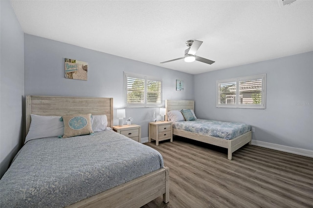 bedroom with wood-type flooring and ceiling fan