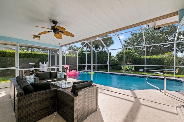 view of pool featuring a lanai, ceiling fan, a patio, an outdoor living space, and grilling area