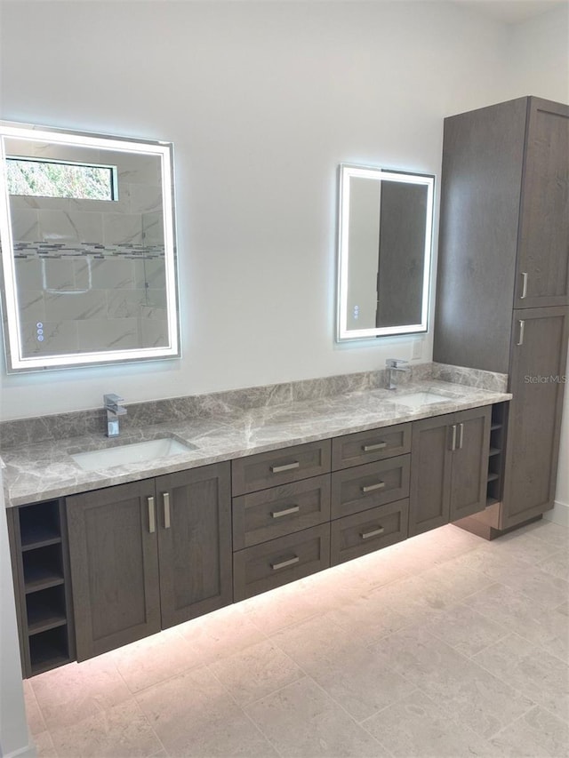 bathroom featuring double vanity and a sink