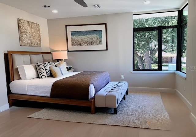 bedroom featuring recessed lighting, visible vents, baseboards, and wood finished floors