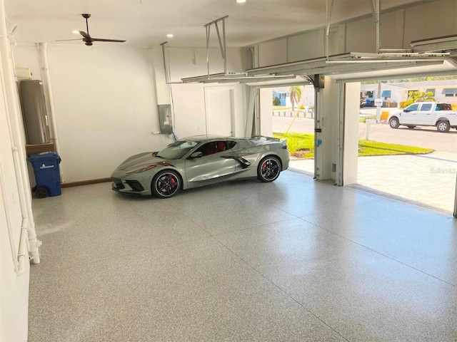 garage with electric panel and baseboards