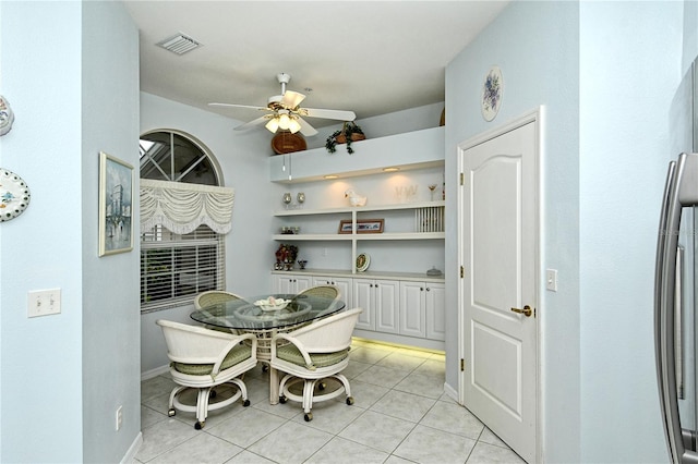 dining area with ceiling fan and light tile patterned floors