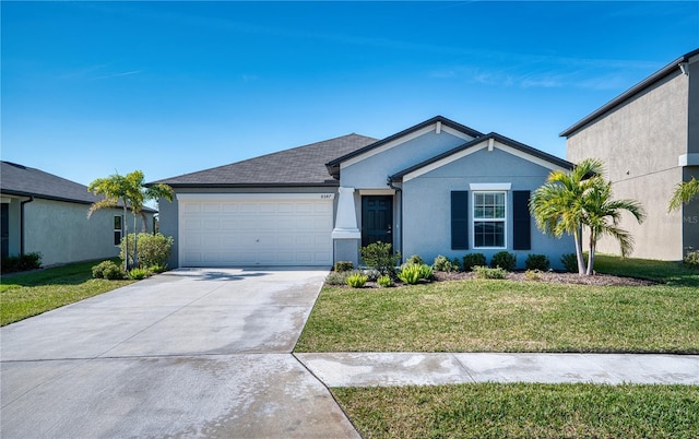 ranch-style house featuring a garage and a front lawn