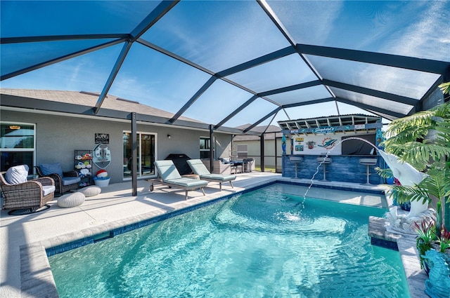 view of pool featuring pool water feature, an outdoor living space, a lanai, and a patio area