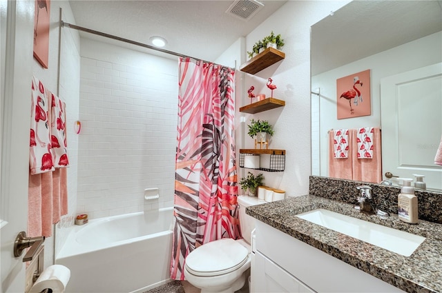 full bathroom with vanity, shower / tub combo with curtain, and toilet