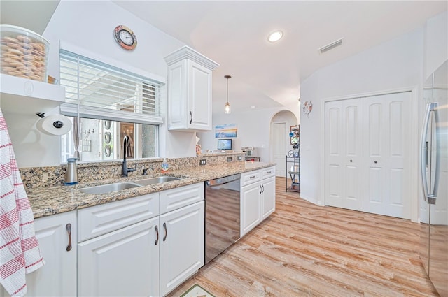 kitchen featuring dishwasher, sink, white cabinets, light stone countertops, and light hardwood / wood-style flooring