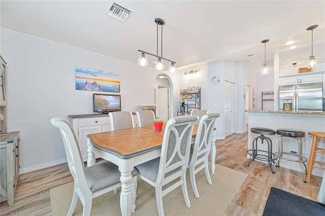 dining space featuring light hardwood / wood-style floors