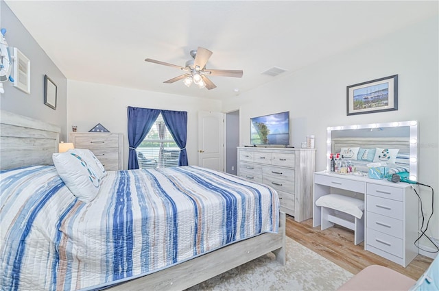 bedroom with ceiling fan and light hardwood / wood-style flooring