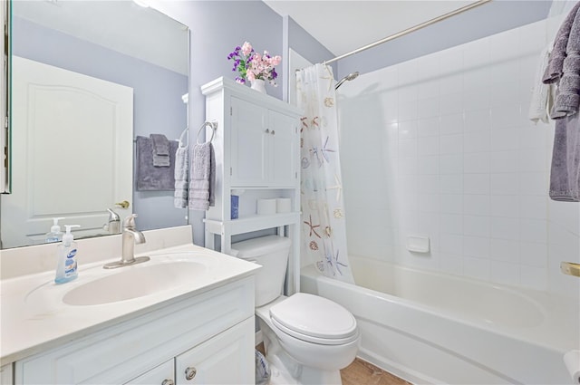 full bathroom with shower / tub combo, vanity, and toilet