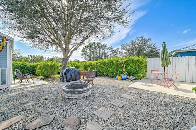 view of patio with grilling area and an outdoor fire pit