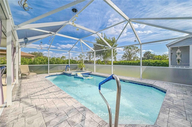 view of pool featuring an in ground hot tub, a lanai, and a patio area